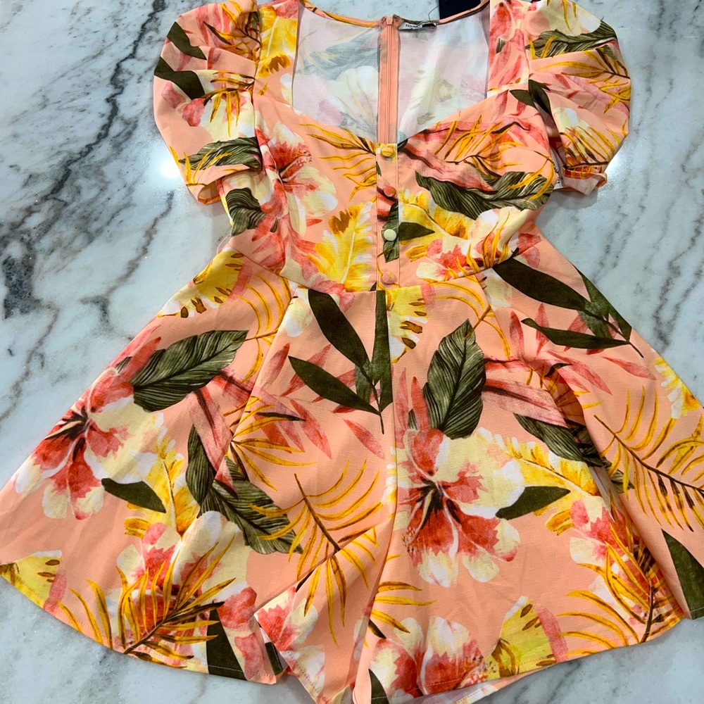 This romper is from FashionNova.